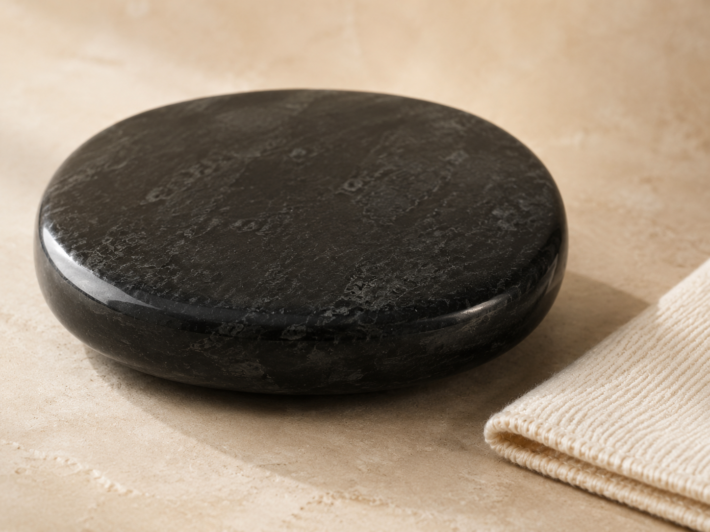 Close-up of a polished black bian stone surface